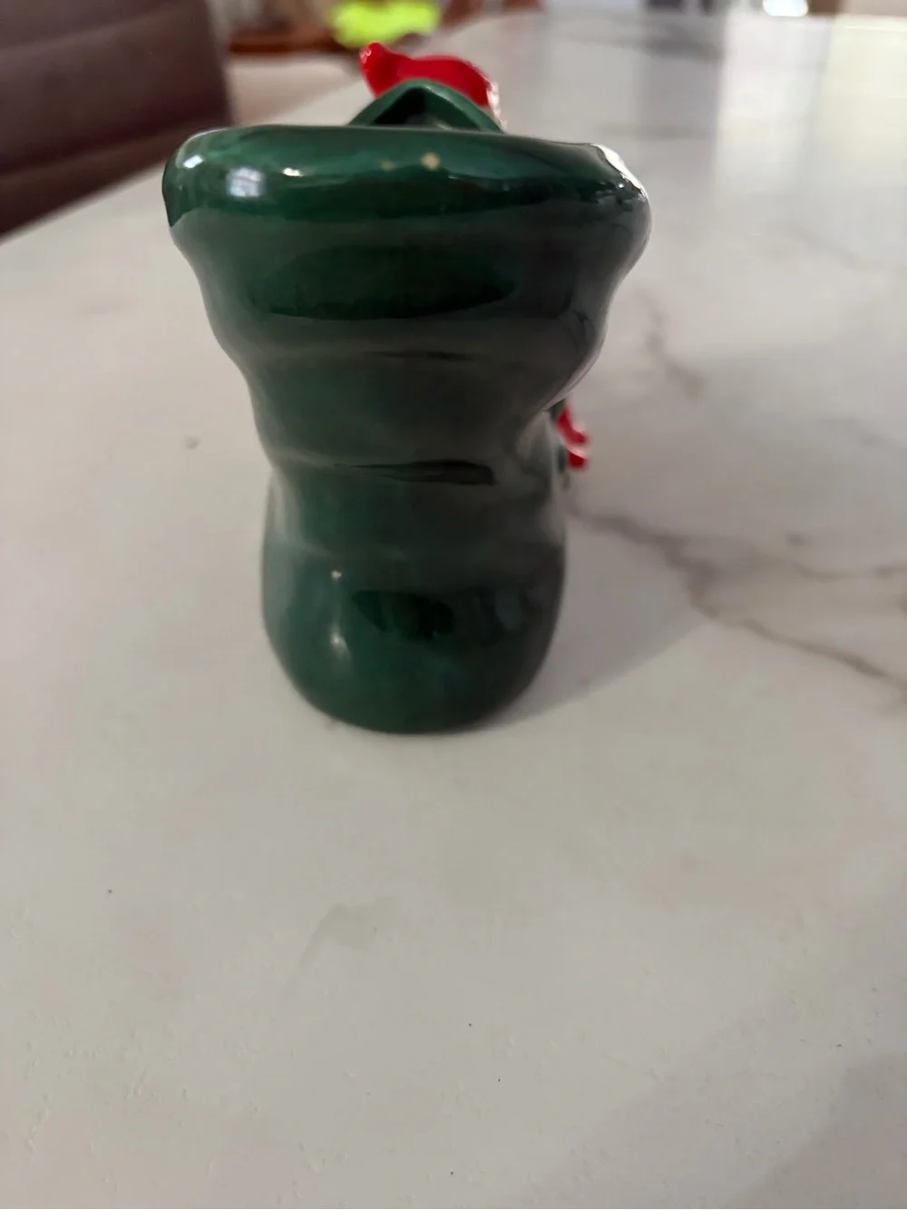 Vintage mid century ceramic pixie elf on a green boot 1950s